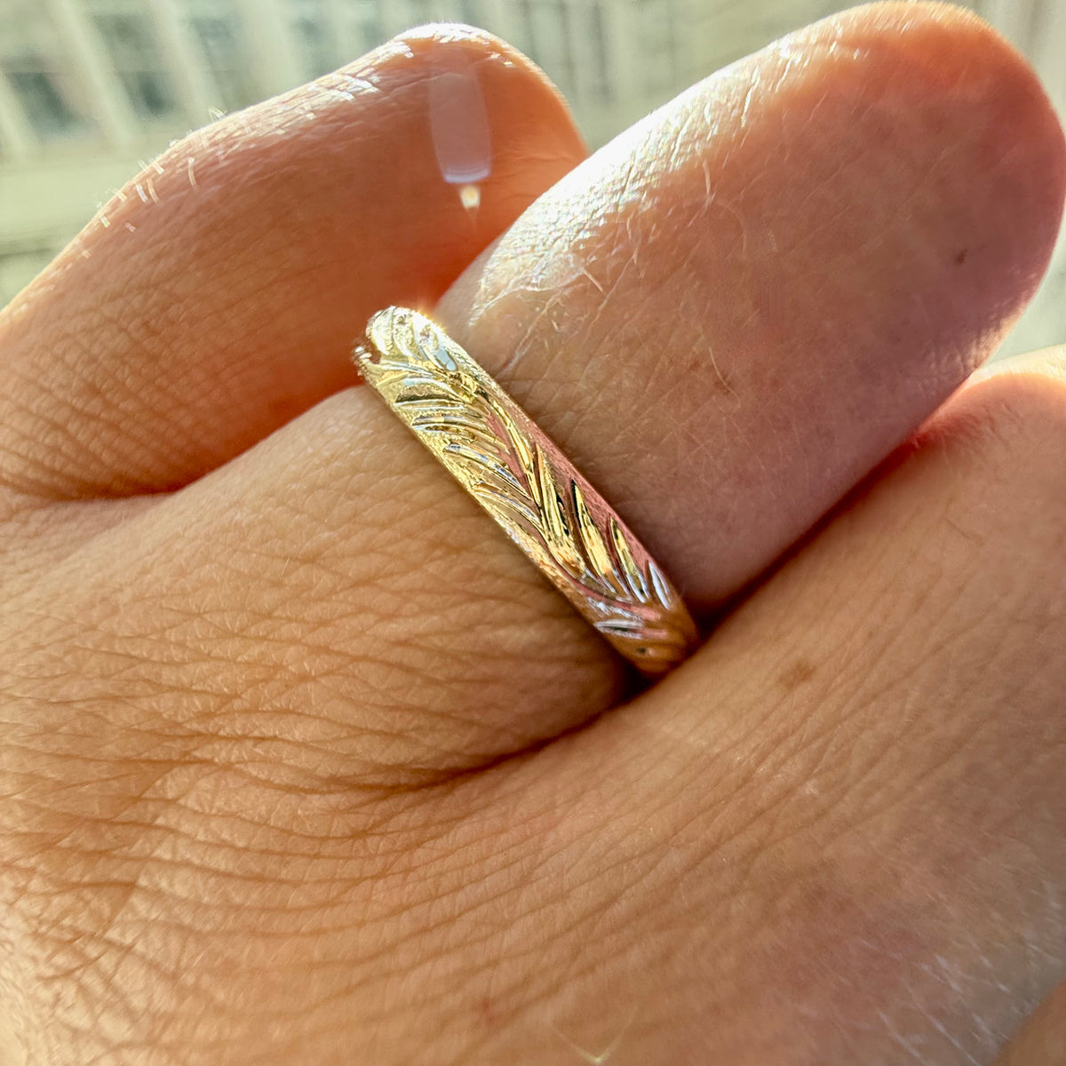 
            Castaway Wave Engraved Gold Band