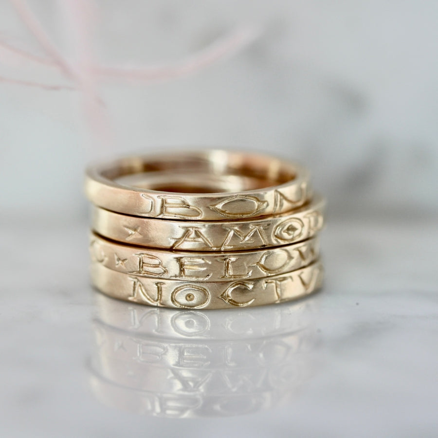 
            amor fati engraved gold band