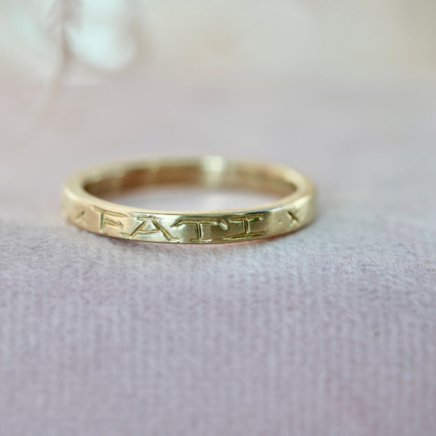 
            amor fati engraved gold band