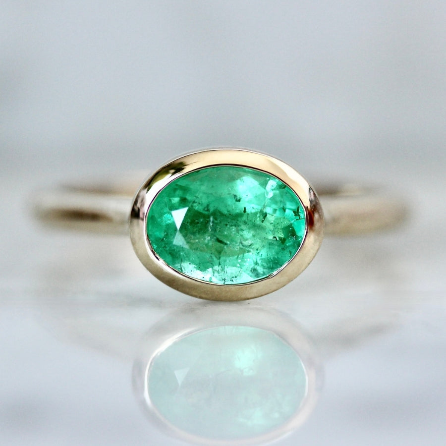 
            bezel emerald ring