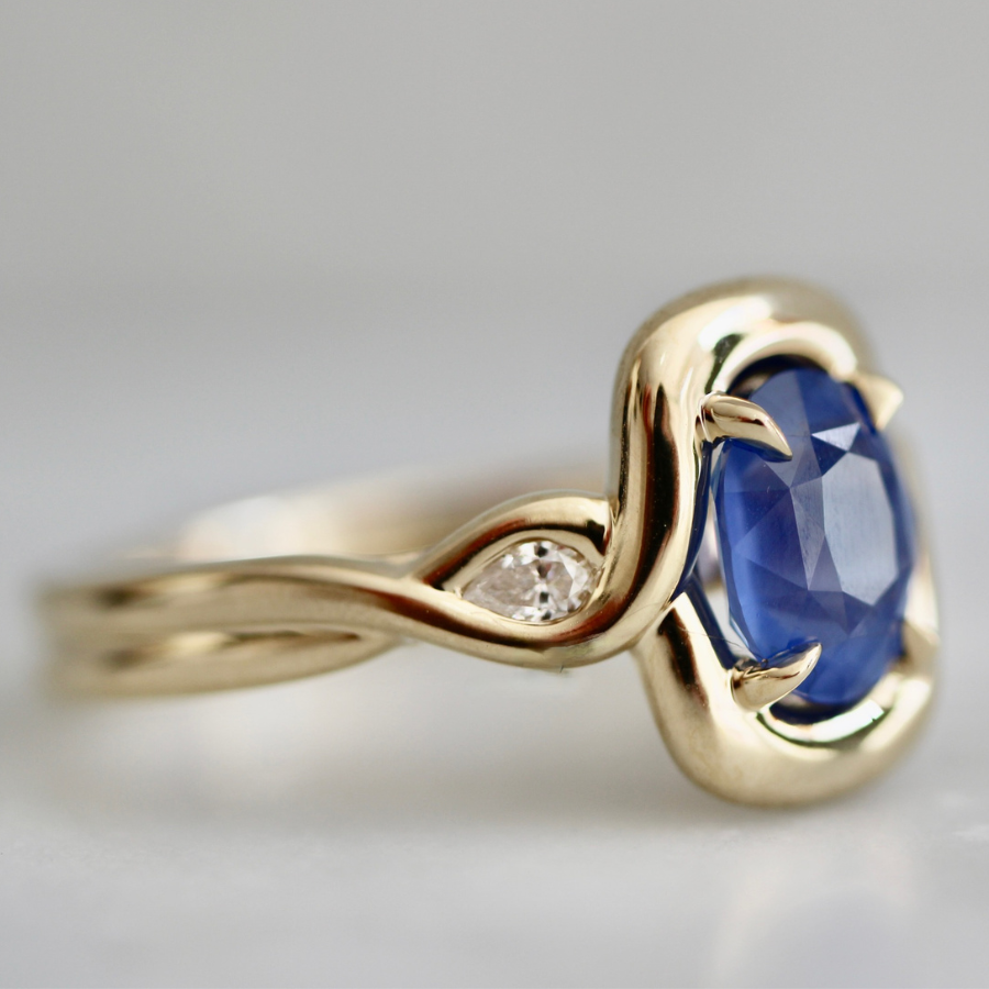 blue oval cut opalescent sapphire ring