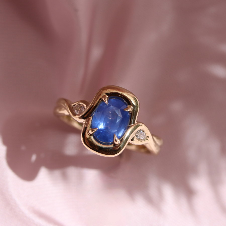 blue oval cut opalescent sapphire ring