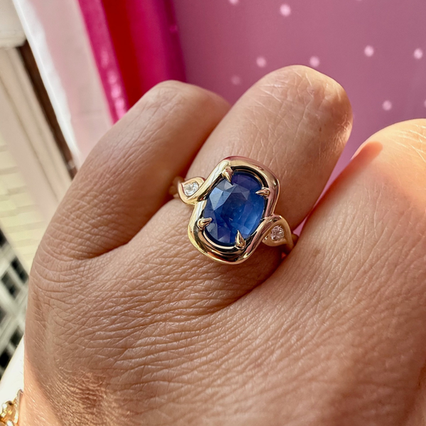 blue oval cut opalescent sapphire ring