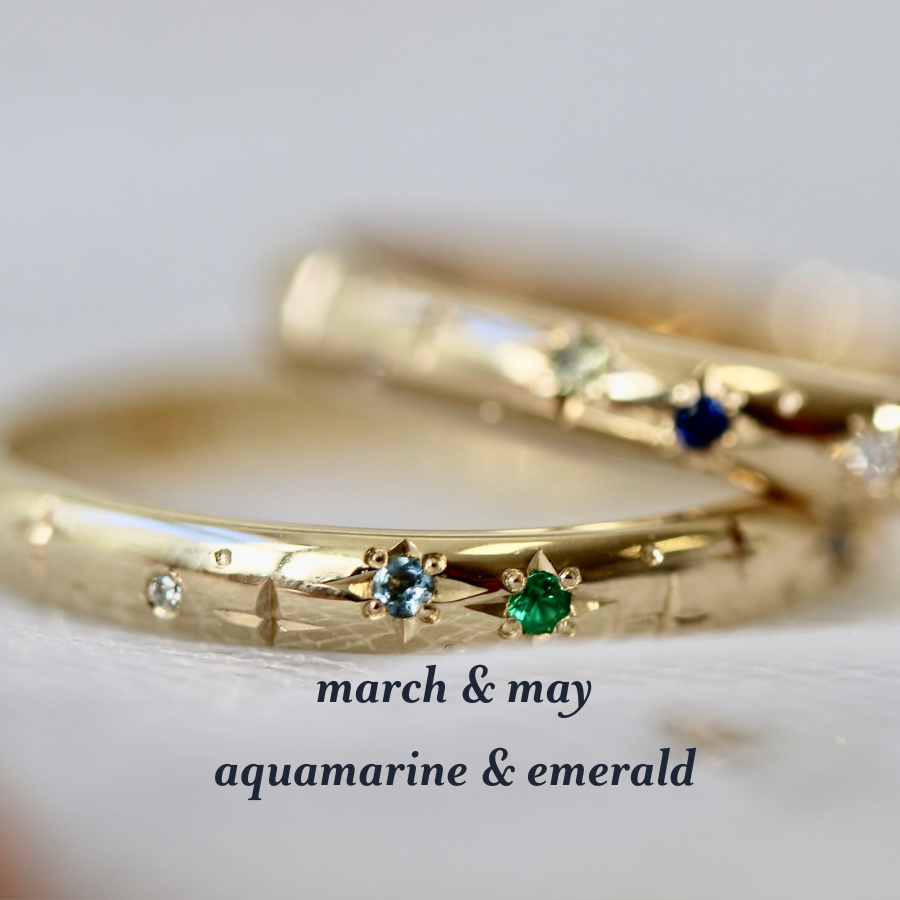 celeste birthstone band with aquamarine and emerald