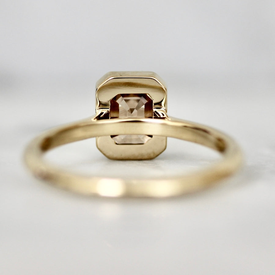 champagne emerald cut diamond ring