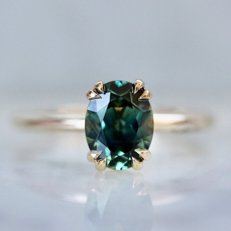 
            green-blue oval sapphire ring