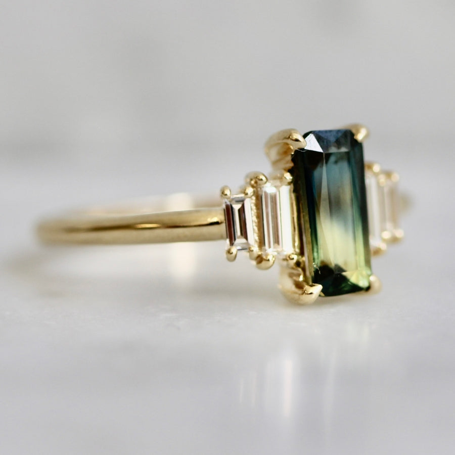 
            green-yellow emerald cut sapphire ring