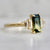 green-yellow emerald cut sapphire ring