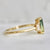 green-yellow emerald cut sapphire ring