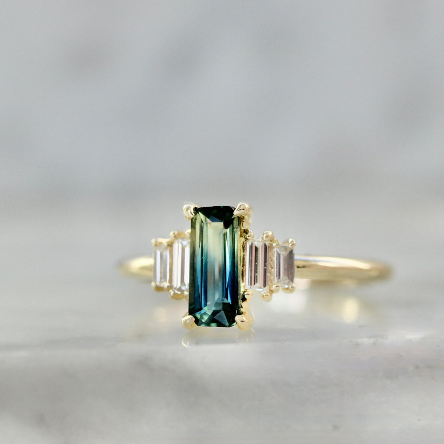 
            green-yellow emerald cut sapphire ring