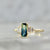 green-yellow emerald cut sapphire ring