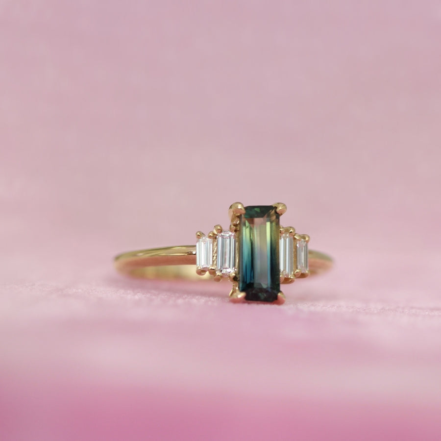 
            green-yellow emerald cut sapphire ring