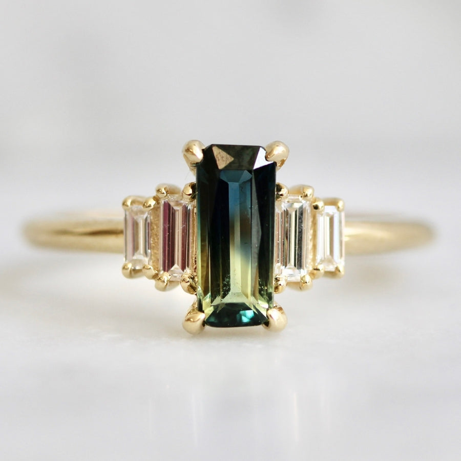 
            green-yellow emerald cut sapphire ring