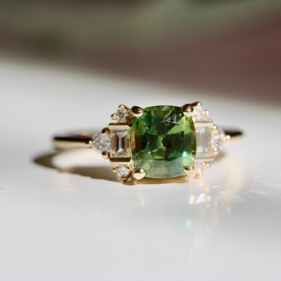 green cushion cut sapphire ring