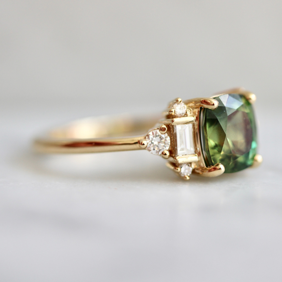 green cushion cut sapphire ring