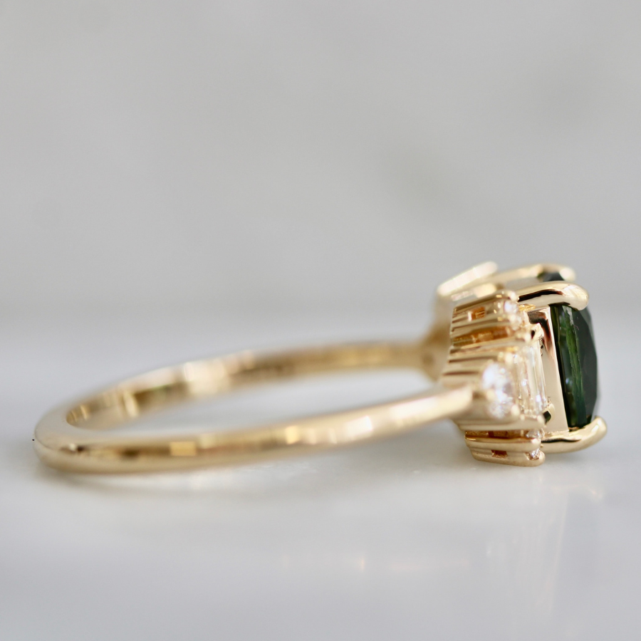 green cushion cut sapphire ring
