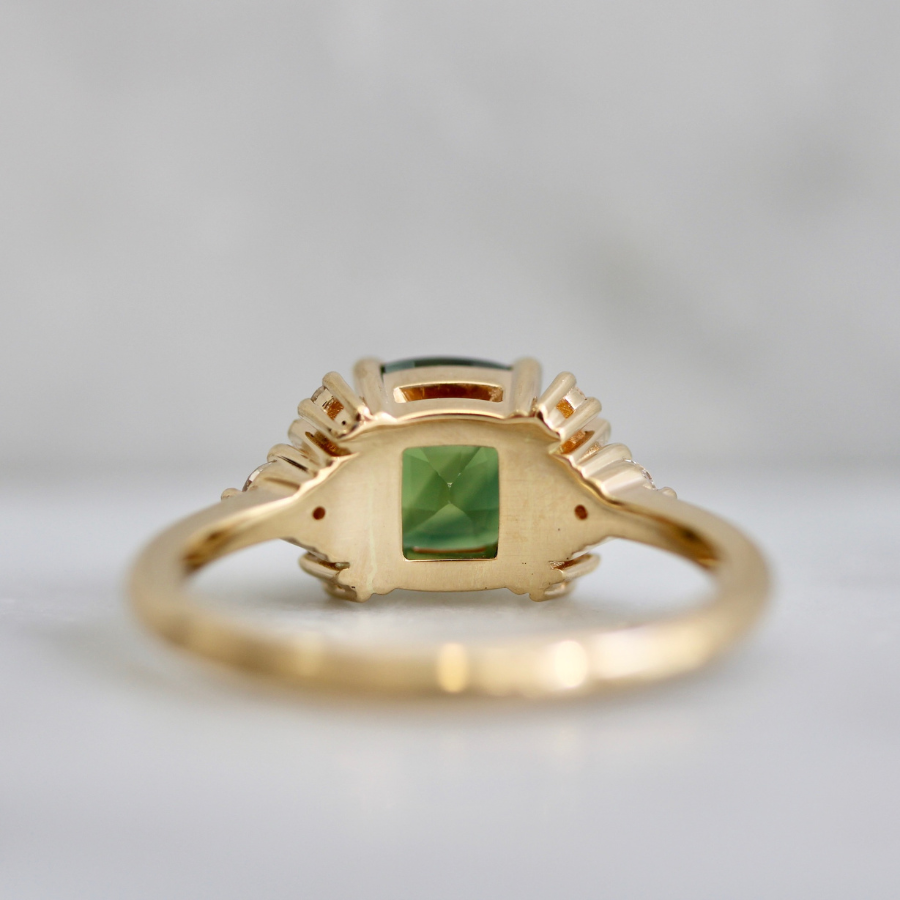 green cushion cut sapphire ring