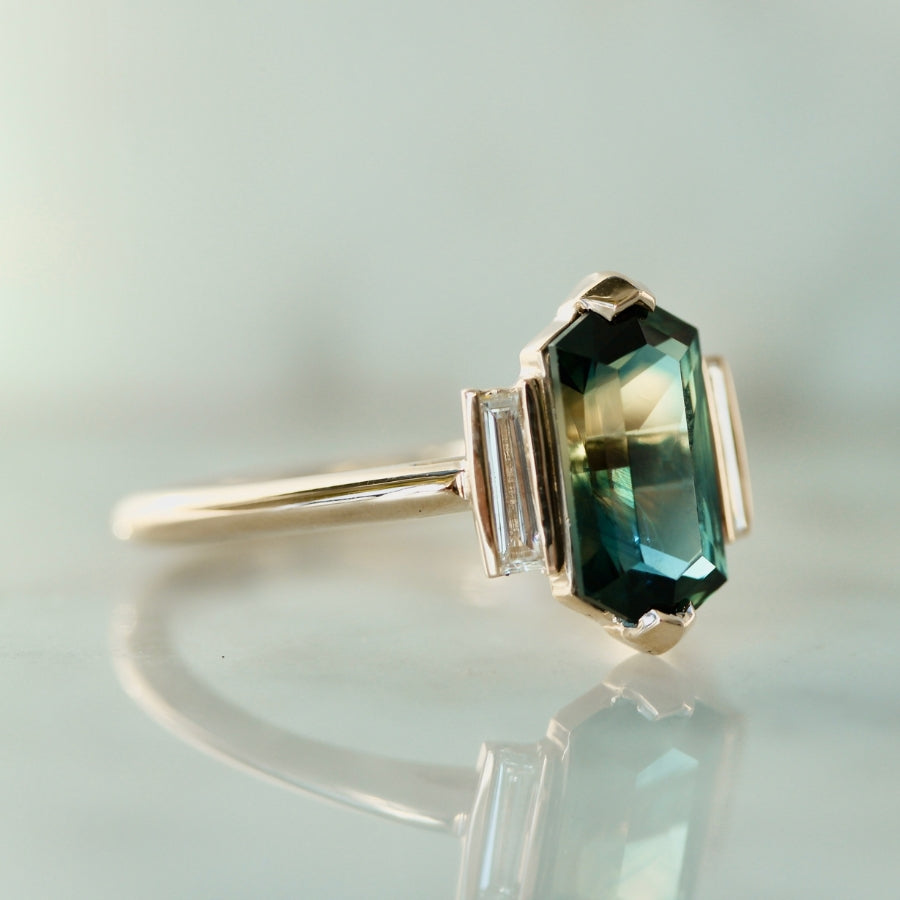 
            hexagon cut green sapphire ring