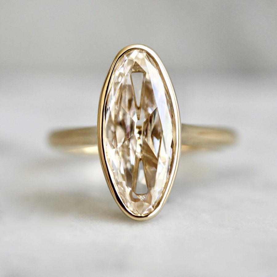moval diamond ring in yellow gold bezel