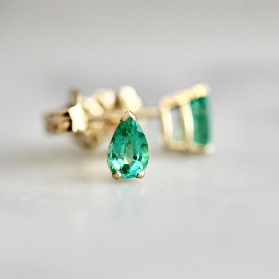 pear cut emerald earrings.