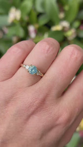 teal round brilliant cut sapphire ring