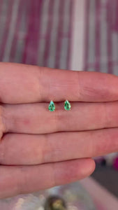 pear cut emerald earrings.