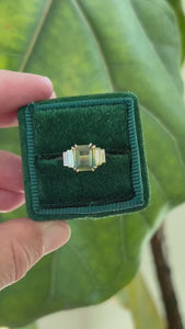 green emerald cut sapphire ring