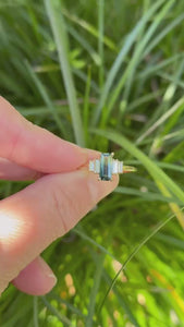 green-yellow emerald cut sapphire ring