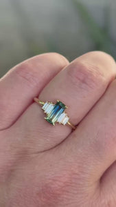 green-yellow emerald cut sapphire ring