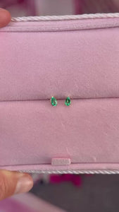 pear cut emerald earrings.