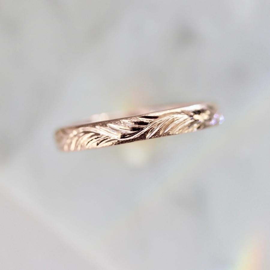 
            rose gold feather engraved band