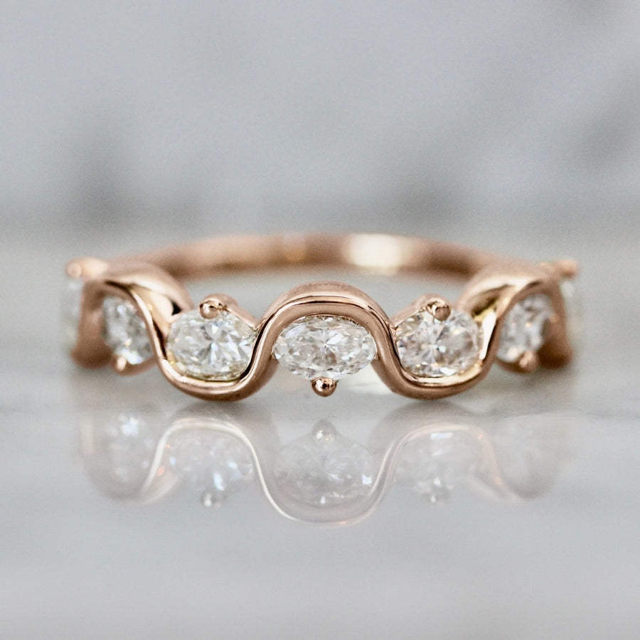 
            rose gold oval diamond wedding band