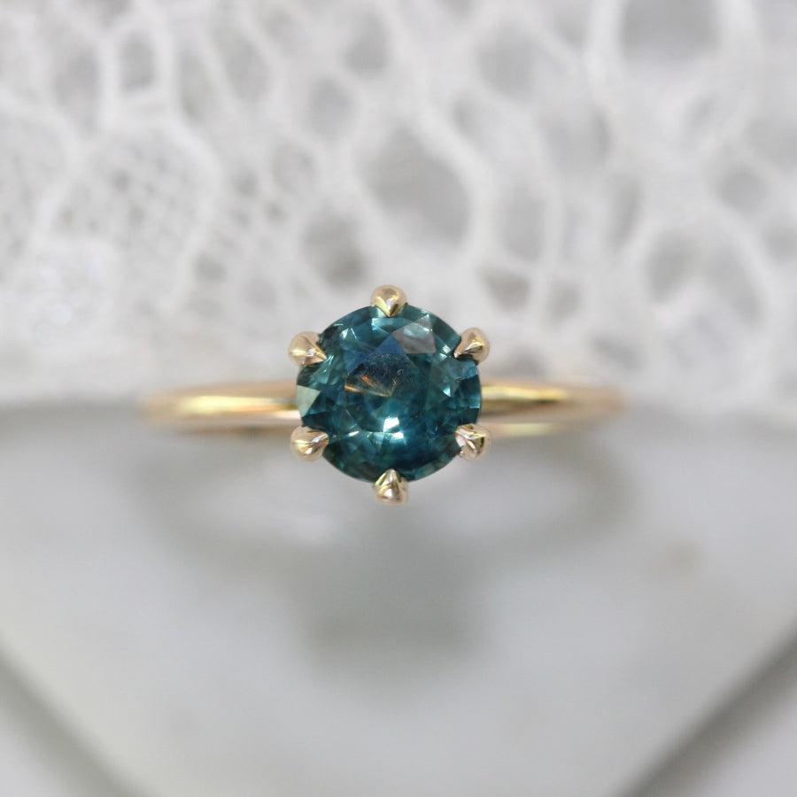 
            round teal sapphire ring