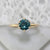 round teal sapphire ring