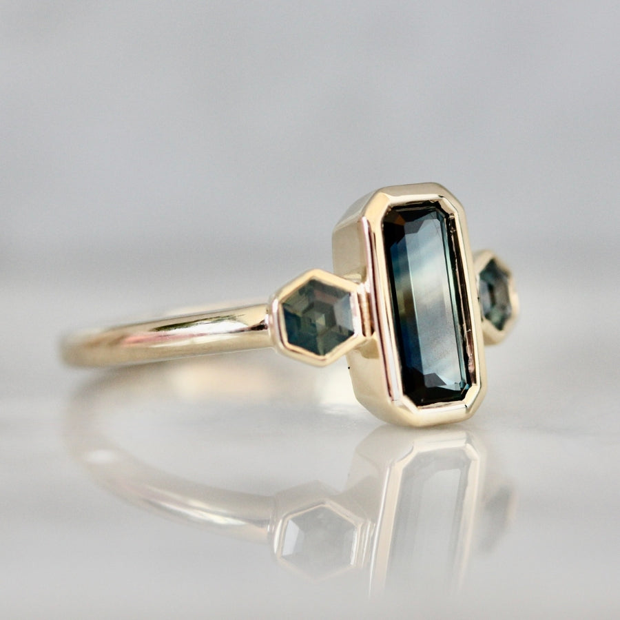 
            teal emerald cut montana sapphire ring