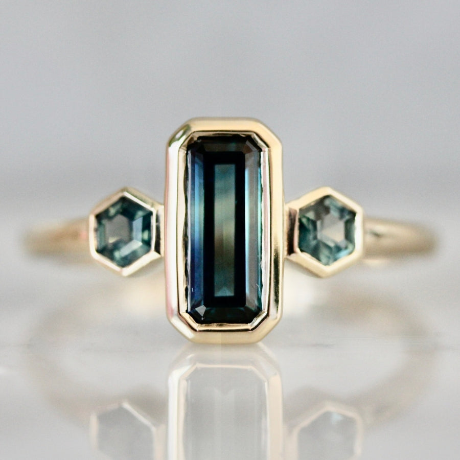 
            teal emerald cut montana sapphire ring