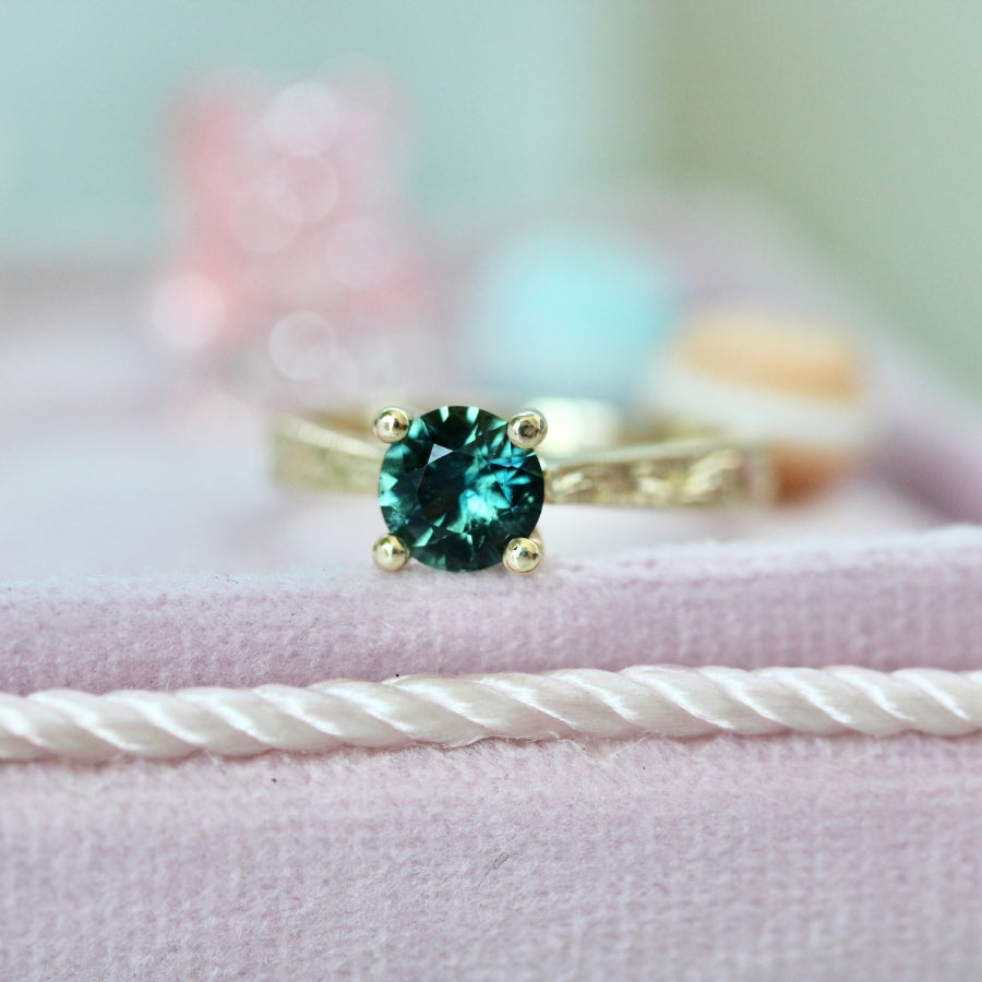 
            teal round sapphire engagement ring