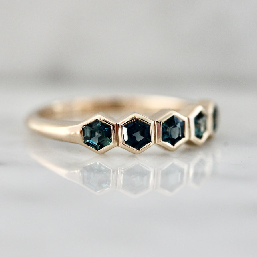 
            teal sapphire band