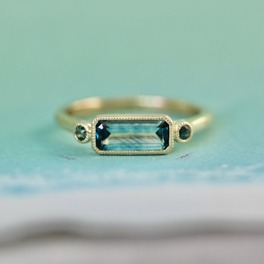 
            teal sapphire bezel ring