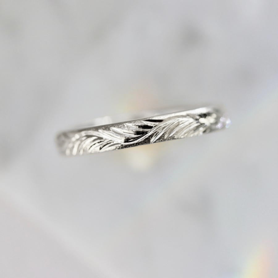 
            white gold feather engraved gold band