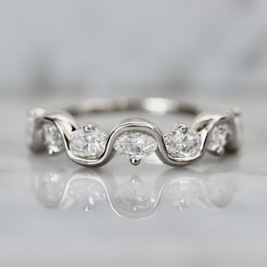 
            white gold oval diamond wedding band