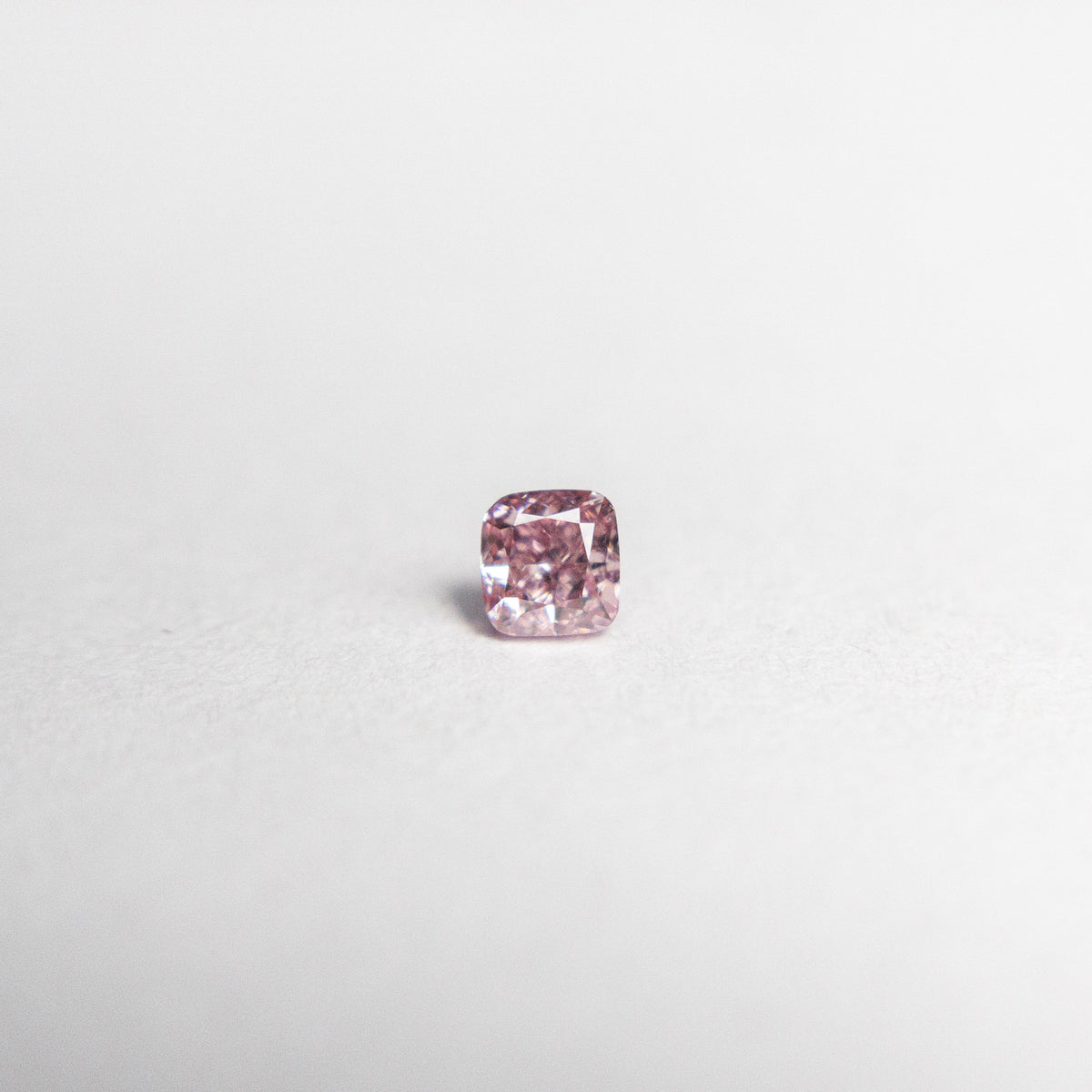 
            0.08ct 2.39x2.27x1.65mm Argyle Fancy Intense Purple Pink Cushion Brilliant 18680-02 - Misfit Diamonds