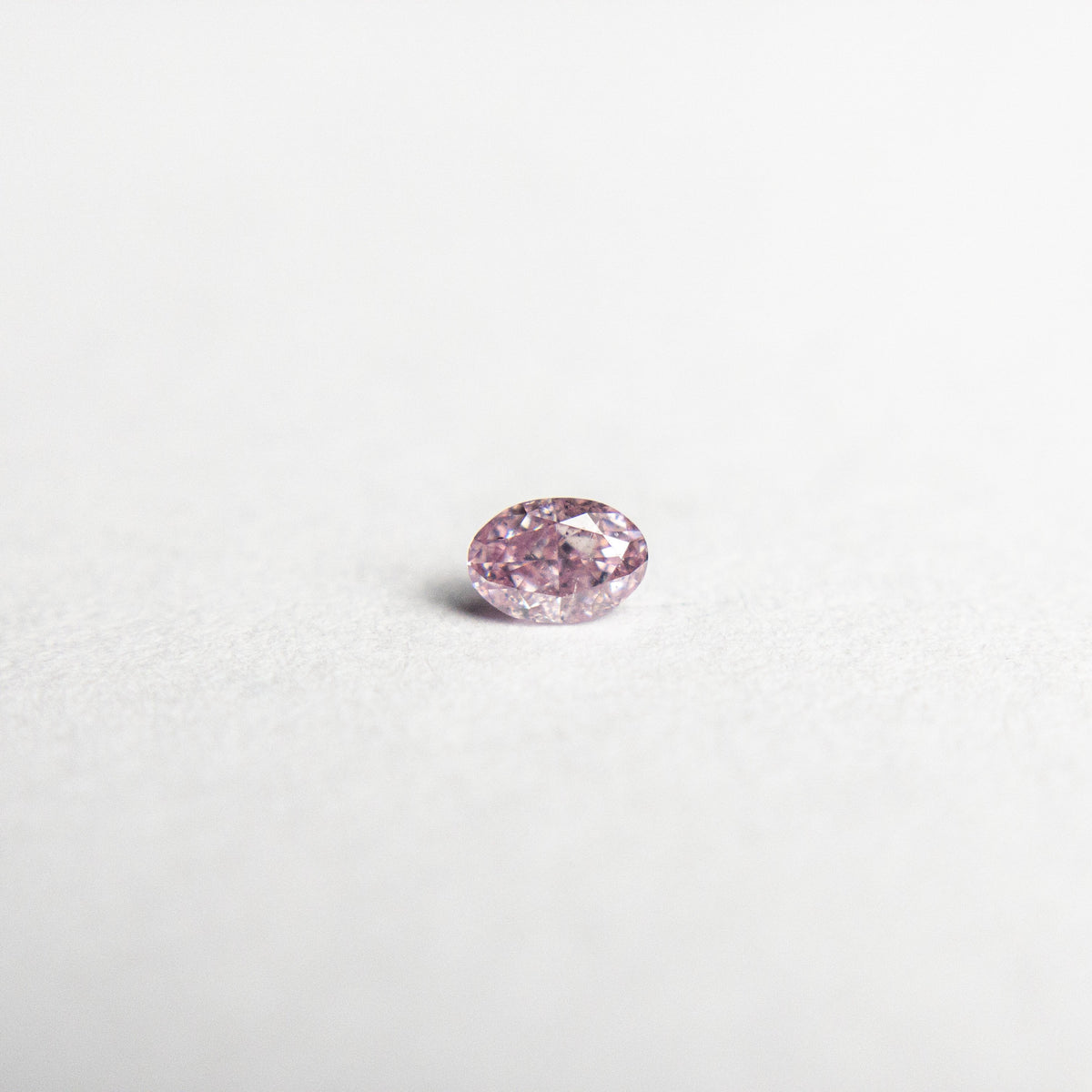 
            0.07ct 3.05x2.12x1.42mm Argyle Fancy Intense Purple Pink Oval Brilliant 18680-10 - Misfit Diamonds