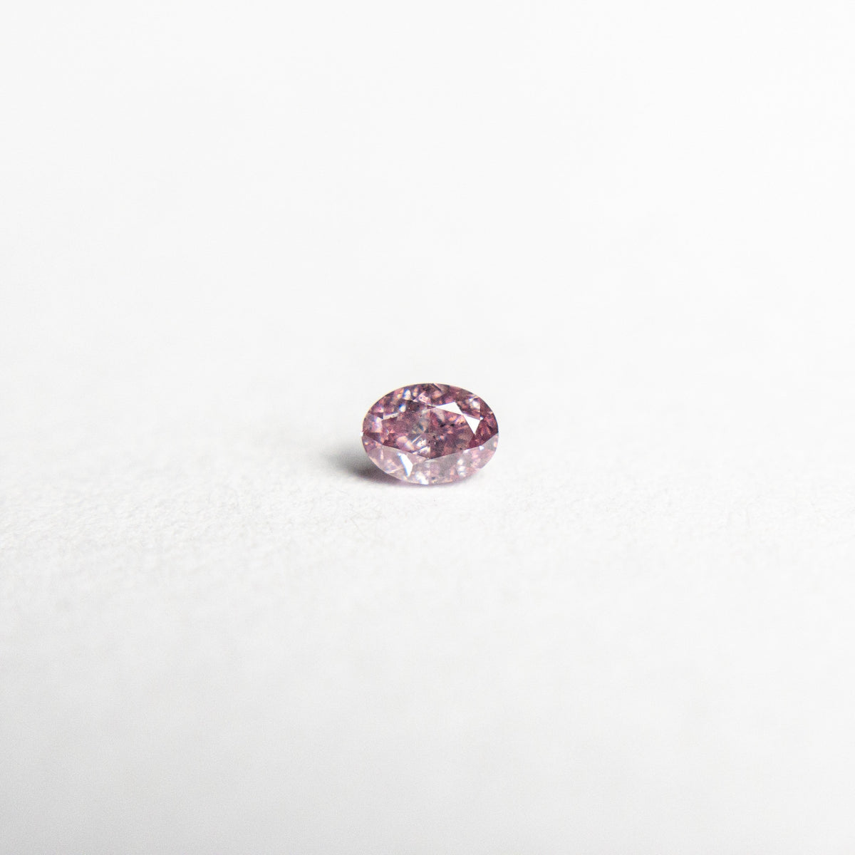 
            0.07ct 2.83x2.07x1.48mm Argyle Fancy Intense Purple Pink Oval Brilliant 18680-11 - Misfit Diamonds