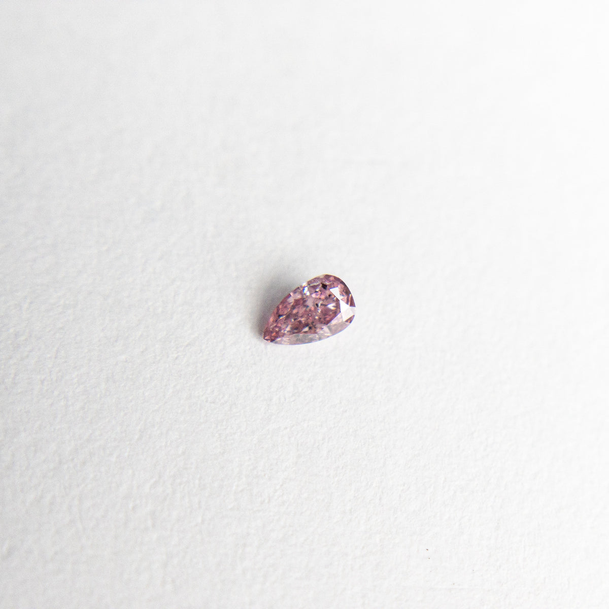 
            0.05ct 3.00x1.82x1.15mm Argyle Fancy Intense Purple Pink Pear Brilliant 18680-12 - Misfit Diamonds
