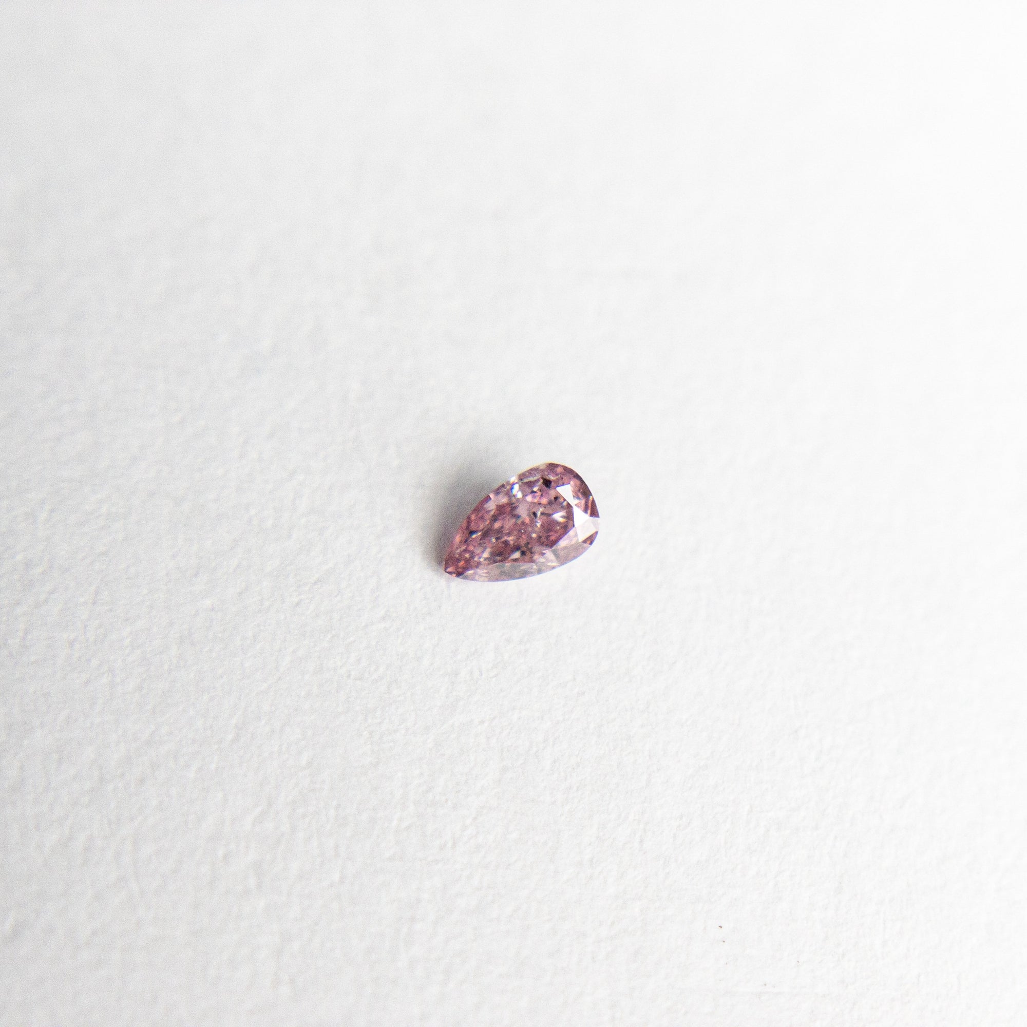 0.05ct 3.00x1.82x1.15mm Argyle Fancy Intense Purple Pink Pear Brilliant 18680-12 - Misfit Diamonds