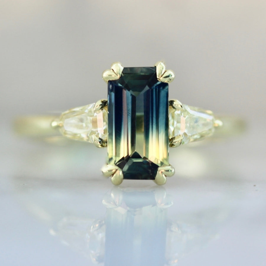 
            Golden Slipper Bi-Color Green Emerald Cut Sapphire Ring