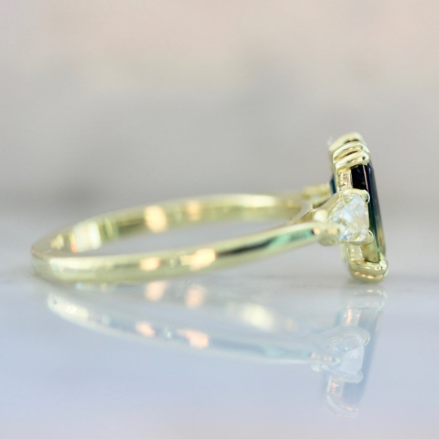 
            Golden Slipper Bi-Color Green Emerald Cut Sapphire Ring