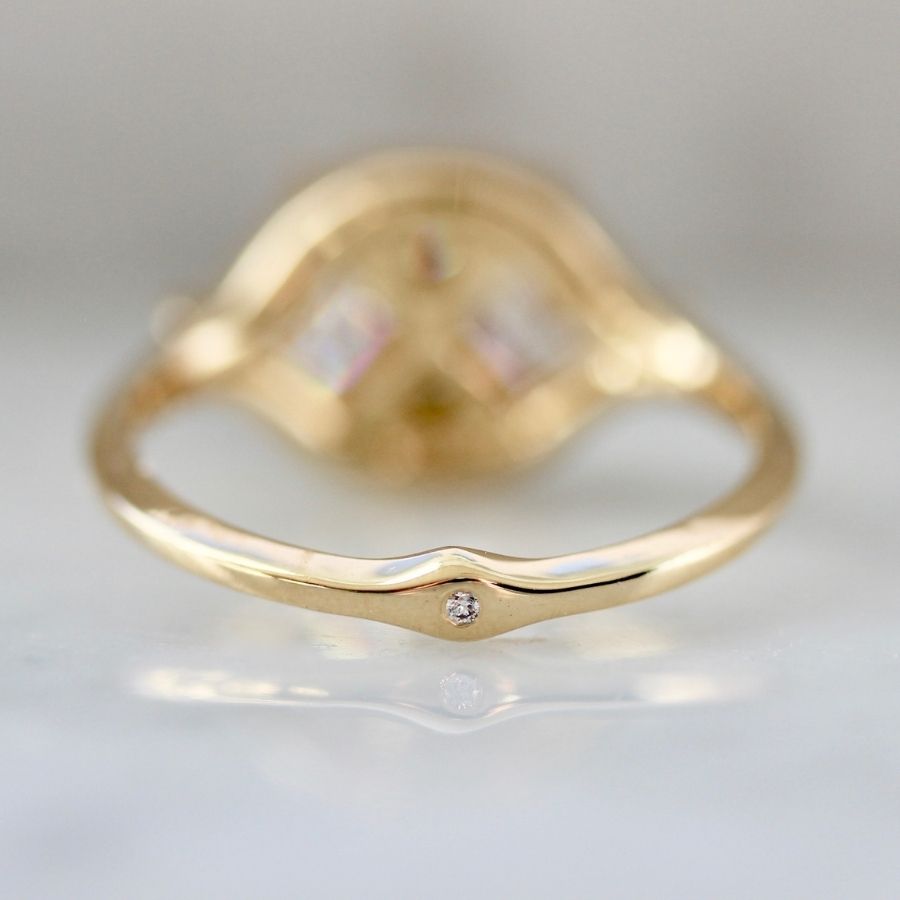 two white carre cut diamonds with six smaller white carre cut diamonds in yellow gold