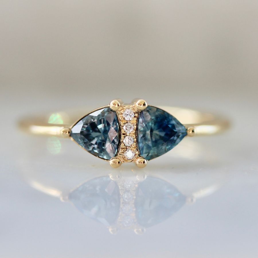 
            Secret Spell Teal Trillion Cut Sapphire Ring